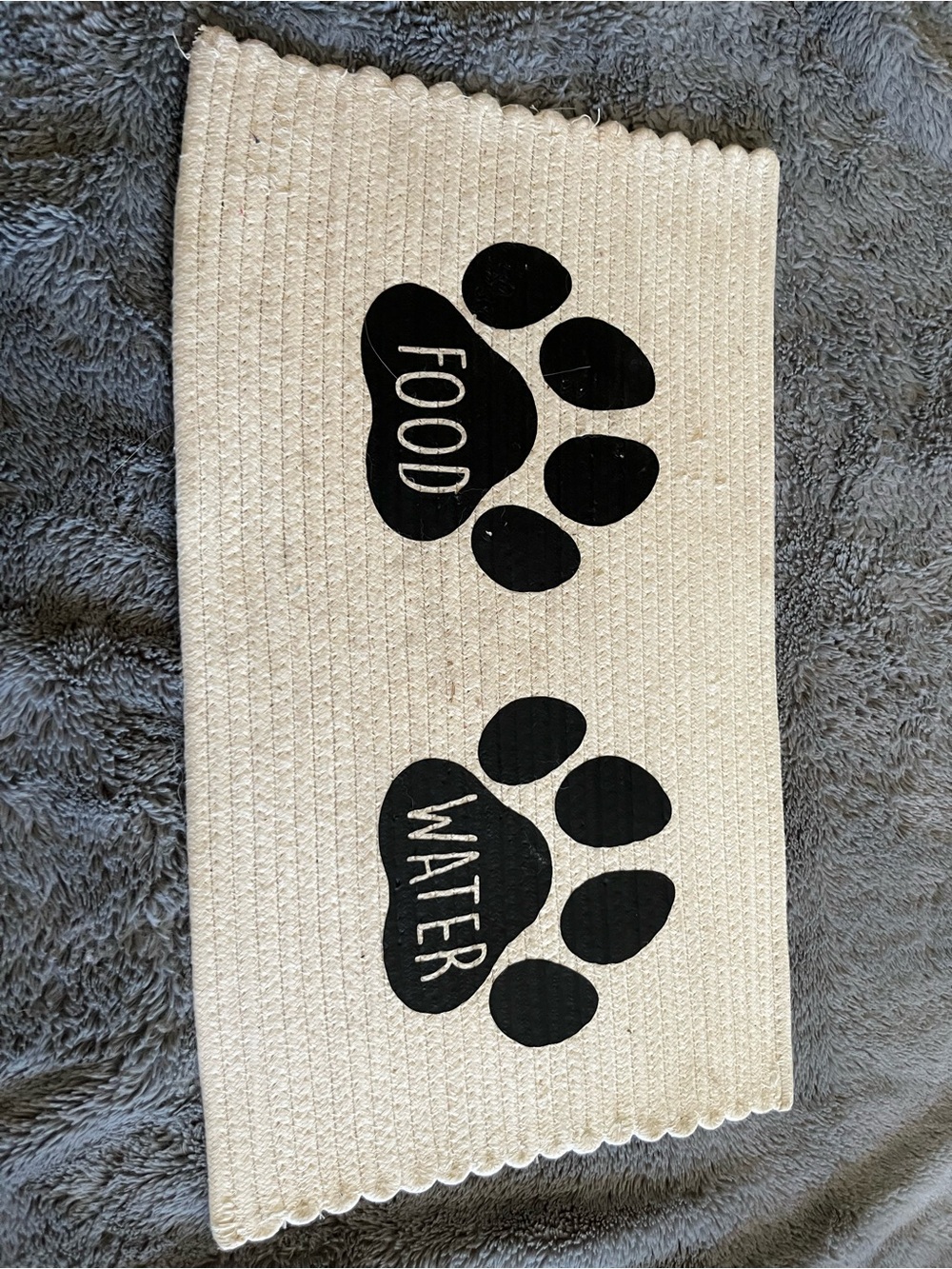 Neutral Cream Pet Feeding Mat with Black Paw Print Design